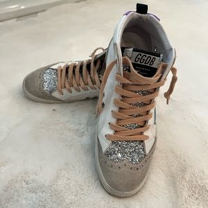 Golden goose. Barely worn cloth side and leather with glitter tongue